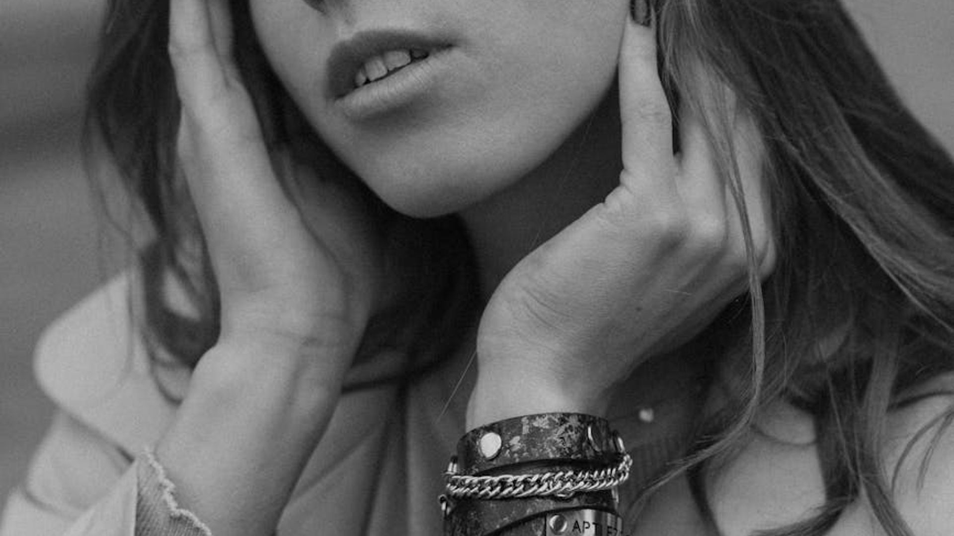 A person in a calm, focused state of movement in a minimalist space.